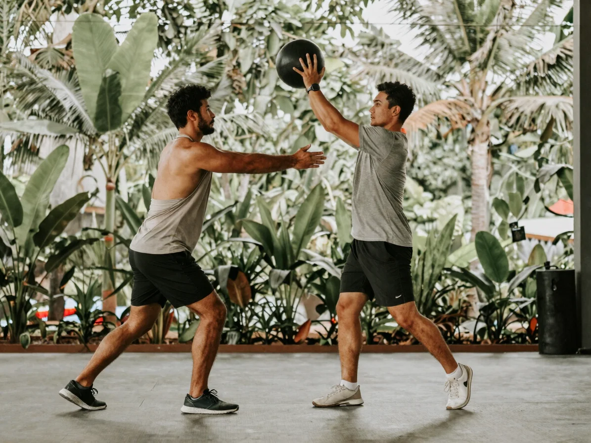 Editorial sports photograph of a trainer and golfer performing a